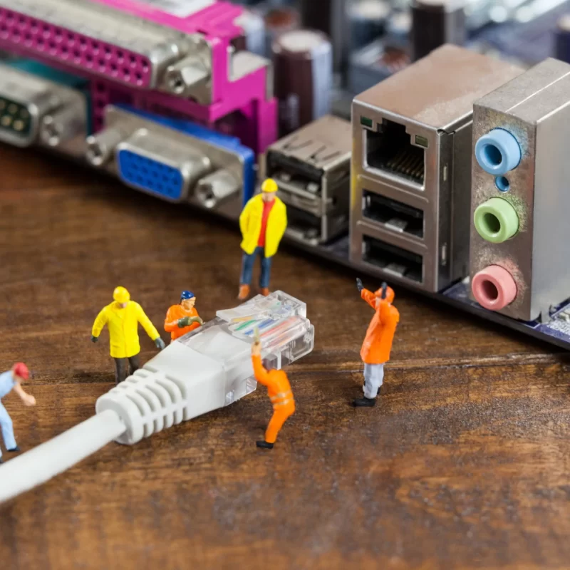 miniature-engineer-worker-plug-lan-cable-computer