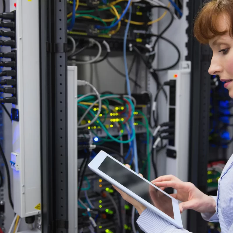technician-using-tablet-pc-while-analysing-server